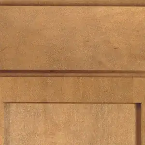 Close-up of a wooden cabinet door with a natural finish.