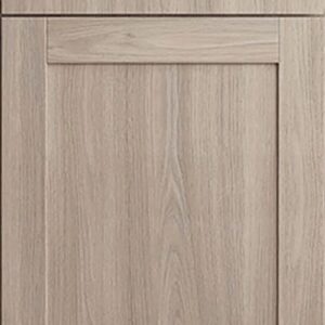 Close-up of light wood kitchen cabinet door with clean design.